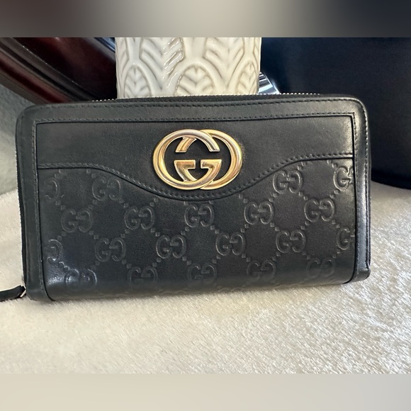 Gucci Handbags - Gucci Large Black leather zip around wallet